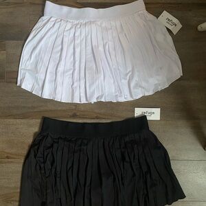 Refuge White and Black Mini Skirts